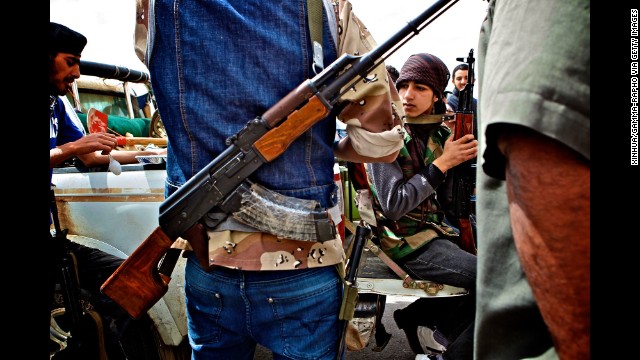 Anti-Libyan-government militants gather on the front line in Brega, Libya, in 2011.