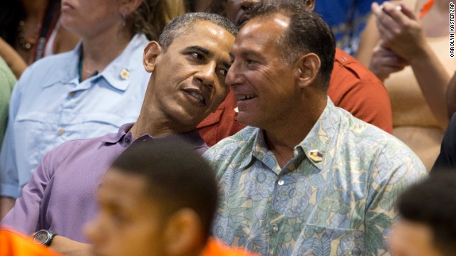 Obama and friend Bobby Titcomb watch college basketball action between Oregon State University and the University of Akron at the Diamond Head Classic in Honolulu on Sunday, December 22.