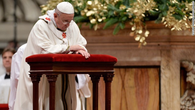 The Pope prays during the service. The festivities began on Saturday, with the Pope's Christmas message to the Curia. He urged the church's governing body to avoid gossip and to focus on service.