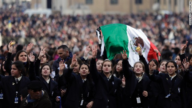 Faithful cheer before the Pope's message. Vatican TV estimated 150,000 attended the blessing in St. Peter's Square, which marked Francis' first Christmas celebration as pope. 