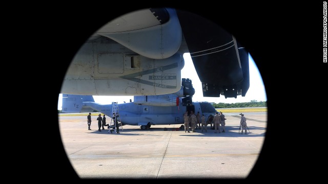 A U.S. Marine Corps' MV-22 Osprey tilt-rotor aircraft is seen through the window of another Osprey at Futenma on August 3. 