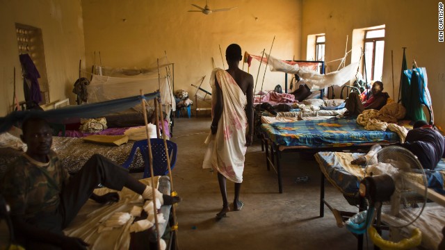 A man walks in a ward where most patients are soldiers with gunshot wounds inside the Juba Military Hospital in Juba on Saturday, December 28.