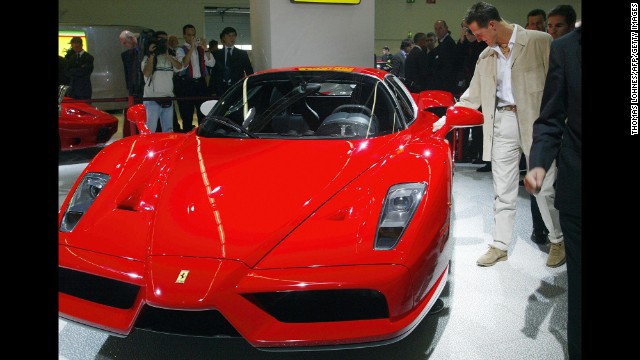Schumacher checks out an Enzo Ferrari at Frankfurt's International Motor Show in 2003.