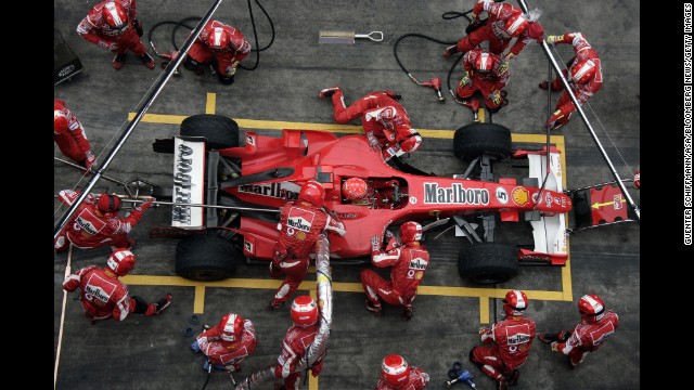 Schumacher's pit team works on his car during the Formula 1 Grand Prix of China in Shanghai in 2006.