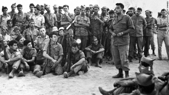 Ariel Sharon addresses troops of Unit 101 before their attack on Khan Yunis in what was formerly known as the Gaza Strip on August 30, 1955. Sharon had established the elite commando group two years before. The officer-turned-politician had a career marked with victories and controversies.