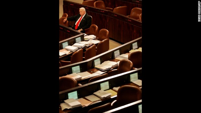 Sharon sits alone as he waits for other Knesset members to arrive for a vote on March 28, 2005. Sharon pushed for Israel's historic 2005 withdrawal from 25 settlements in the West Bank and Gaza, which was turned over to Palestinian rule for the first time in 38 years.