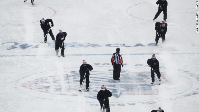 Play was stopped twice in the first period in order for crews to shovel snow off the ice.