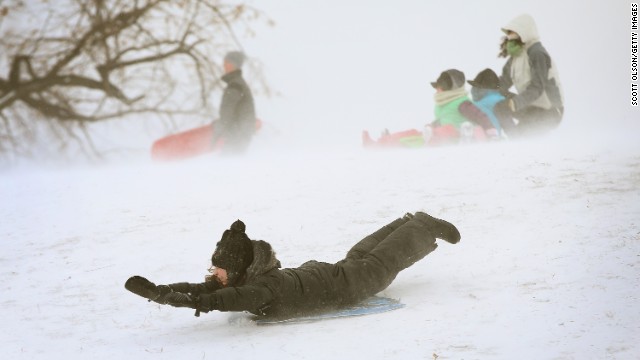 A child sleds down a hill in Chicago's Humboldt Park on Thursday, January 2.