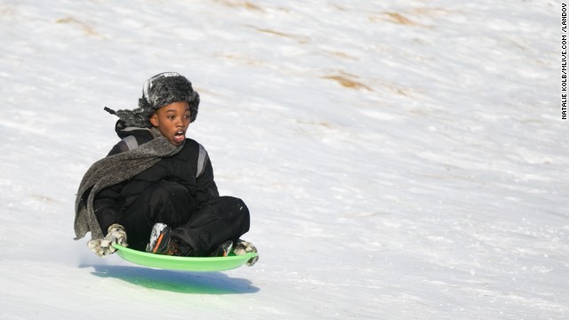 Dallas Todd, 11, flies down a snowy hill at Lake Harbor Park in Norton Shores, Michigan, on January 2.