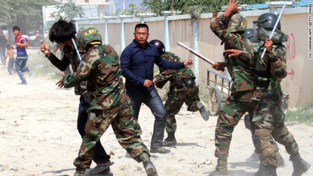 Cambodian soldiers clash with protesters during a rally by garment workers calling for higher wages in front of a factory in Phnom Penh on January 2.