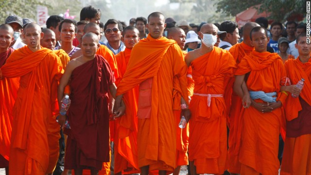 Cambodian Buddhist monks stand together to form a barricade as they participate in a garment workers' strike outside a factory on the outskirts of Phnom Penh on Thursday.