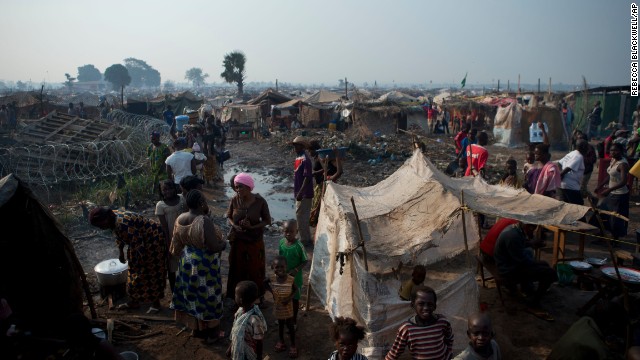 People displaced by violence attempt to create a semblance of normal life in a sprawling camp at M'poko Airport in Bangui on January 2.