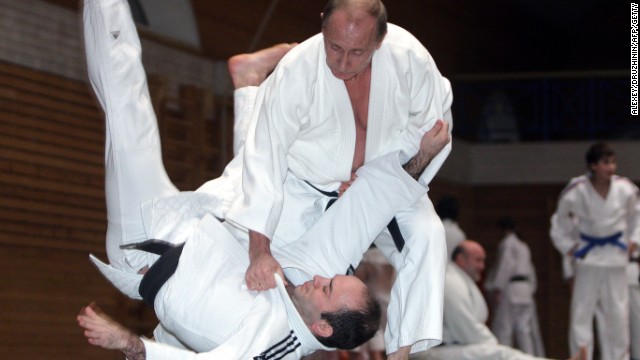 Putin shows off his legendary judo skills on a visit to a center in St Petersburg.