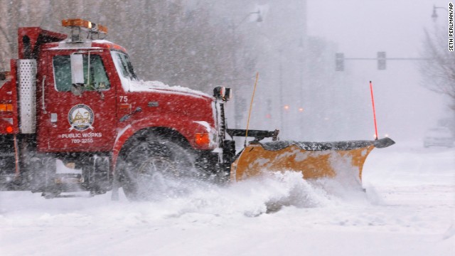 A city snowplow clears the street in an almost-deserted downtown Springfield on January 5.