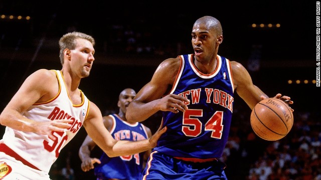 Power forward Charles Smith, dribbling the ball in this photo, played nine NBA seasons after being drafted third overall by the Los Angeles Clippers in 1988. He averaged 14.4 points and 5.8 rebounds during his career.