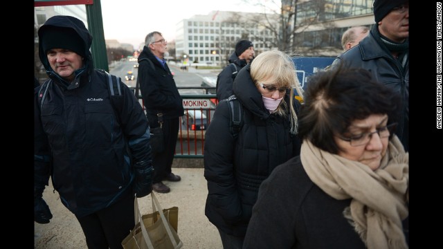 Commuters wait for a Virginia Railway Express train to arrive at Washington's L'Enfant Plaza on January 6.