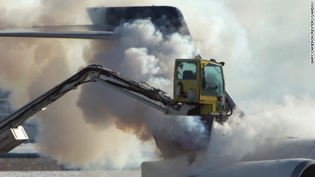 An airplane is de-iced at Ronald Reagan Washington National Airport on January 3.