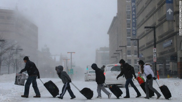 Travelers in Boston leave the Back Bay train station on January 3.