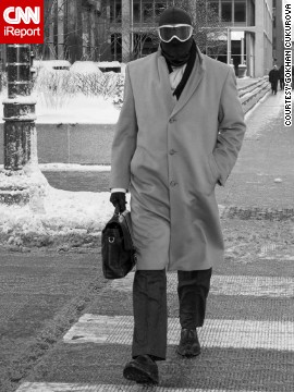 A Chicago man heads to work on January 6 with an overcoat and briefcase ... plus a balaclava and ski goggles.