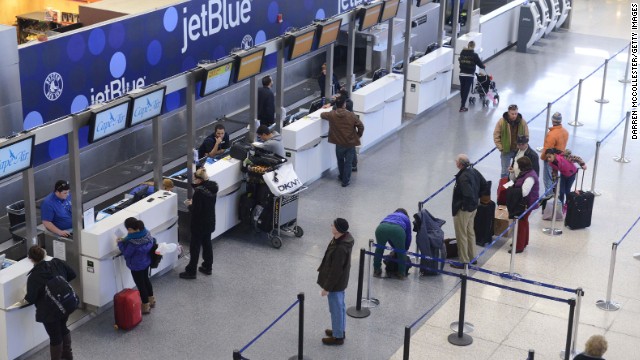 JetBlue passengers in Boston wait for normal flights to resume at Logan International Airport on January 7.