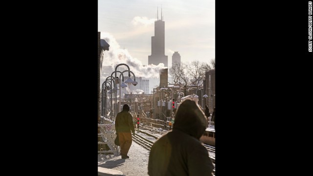 Passengers wait for a train to arrive in Chicago on January 7, when temperatures were below zero.