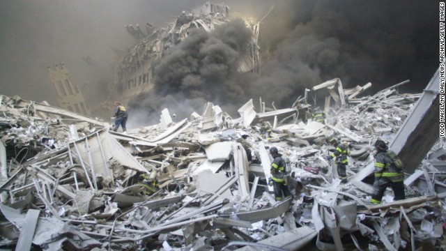 Firefighters look for survivors in the rubble of the World Trade Center after the terrorist attack on September 11, 2001.