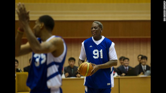 Rodman and Jerry Dupree react to a play during the game.