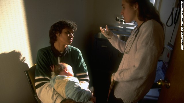 A Medicaid recipient brings her daughter to a hospital in 1995. Medicaid, a federally run health program, was designed to provide coverage for low-income and disabled individuals.