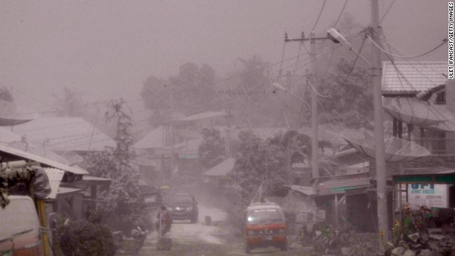 A village is covered in ash.