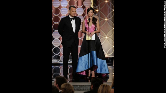 Tom Hanks and Sandra Bullock present the award for best supporting actress in a motion picture. Jennifer Lawrence won for her role in the movie "American Hustle."