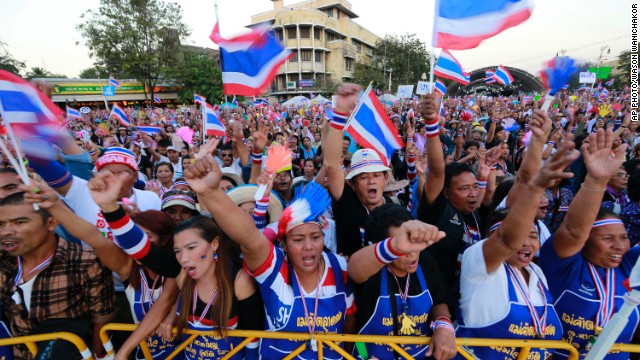 Thai anti-government protesters shout and cheer during a rally at the Democracy Monument in Bangkok on Sunday, January 12, 2014.