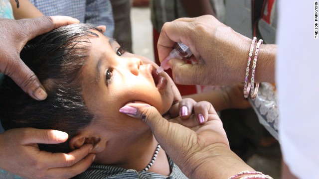 The disabling disease can be prevented with a vaccine. A boy receives an oral vaccine in 2013. 