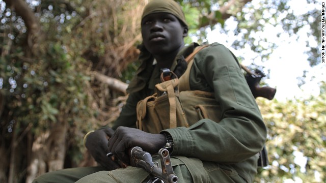 A member of Sudan Peoples Liberation Army (SPLA) sits outside the governor's compound in Malakal on January 12, 2014.