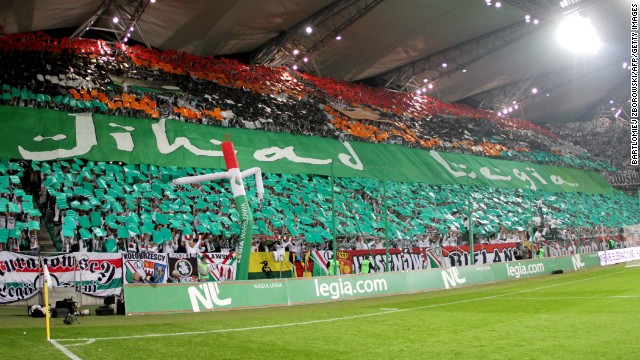 This banner was held aloft by Legia Warsaw fans during the game with Hapoel Tel Aviv. The banner, which had the Arabic word "Jihad" emblazoned on it, was used to incite visiting supporters.