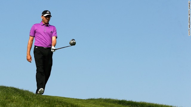 Spain's world No.10 Sergio Garcia walks the undulating desert course under brilliant blue skies