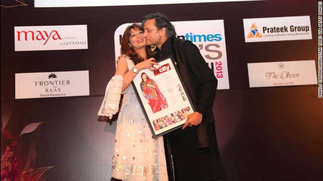 Indian Human Resources Minister Shashi Tharoor kisses his wife, Sunanda Pushkar, at the "Delhi's Most Stylish People's Choice Awards 2013" at the Oberoi Business Hotel on March 21, 2013, in Gurgaon, India. His wife was found dead in a luxury hotel after accusing him of being unfaithful. Her body was taken to the All India Institute of Medical Sciences for examination.