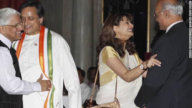 Tharoor and his wife, with Ashwani Kumar, left, and Shiv Shankar Menon, attend a swearing-in ceremony for new ministers at Rashtrapati Bhavan, the Indian President's home, on October 28, 2012, in New Delhi. The couple was active in New Delhi's glamorous social circles.<!-- -->
</br>