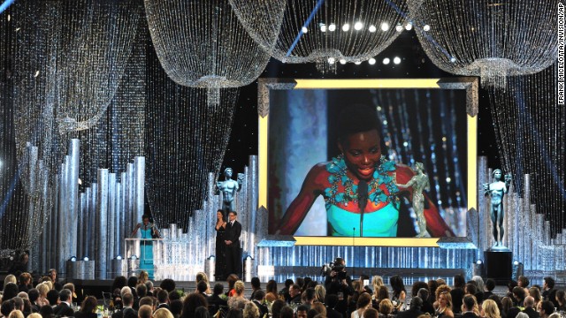 Lupita Nyong'o accepts the award for outstanding performance by a female actor in a supporting role for her part in "12 Years a Slave."