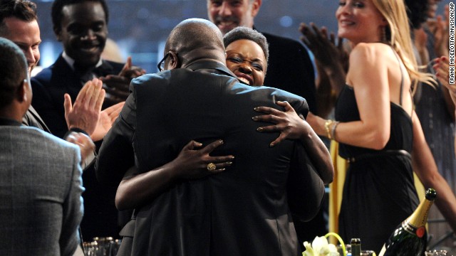 Nyong'o embraces director Steve McQueen after winning her award.