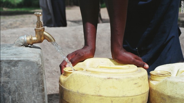 People collect water from a new water source at Mbeme Primary School in Kisumu, Kenya.