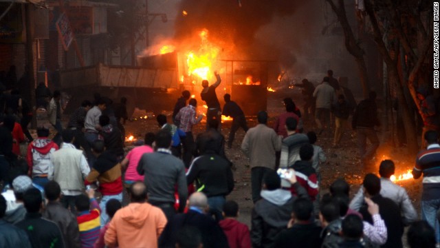 Protesters and Egyptian riot police clash in Cairo on January 17, as the country awaits the results of a constitutional referendum. On January 18, the electoral commission announced the constitution had overwhelmingly been approved.
