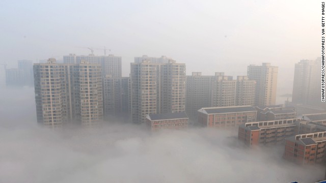 Smog shrouds buildings in Changsha in Hunan province on January 14.