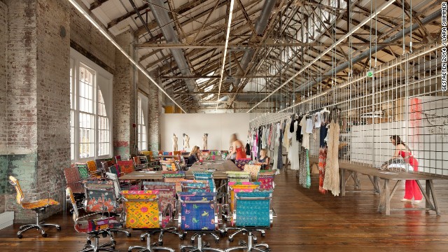 The derelict warehouses that comprise Urban Outfitters corporate campus dovetail nicely with the brand's kooky fashion sense. Indoor walkways are lined with ponds and flowers to offset the industrial feel, and brightly-patterned chairs pop amid the gritty surroundings.