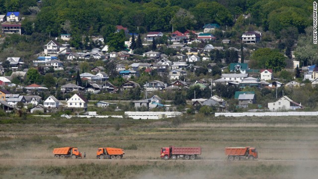 Construction vehicles travel along the Imeretinskaya Valley, the site of Olympic facilities for the 2014 Winter Olympics in Sochi, in April 2009. <!-- -->
</br>Ice events will be held in a "cluster" near the Black Sea in the Imeretinskaya Valley. The second "cluster" will be for skiing and sliding events and will be held in the Krasnaya Polyana Mountains. 