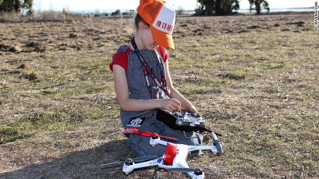 Zolie Sarriugarte, 7, gets ready to take a drone for a spin. Sarriugarte likes drones because "if there's a ball stuck up in a tree you can go fly over and knock the ball out."