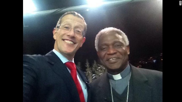 Richard Quest manages to snap a selfie with cardinal Turkson, as he brought a message from Pope to Davos.