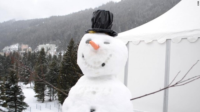 The traditional World Economic Forum snowman stands guard outside CNN's live position.