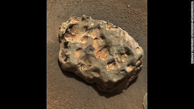 Opportunity discovered the first meteorite identified on a planet other than Earth. The rover's panoramic camera photographed the basketball-size object mostly composed of iron and nickel on January 6, 2005. 