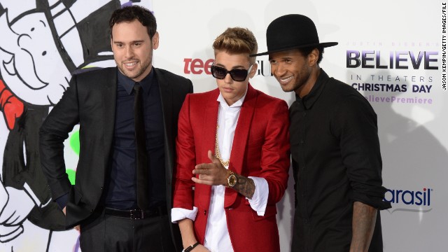 Justin Bieber is rarely spotted without a crew of a few friends, which sometimes also includes his longtime manager, Scooter Braun (pictured left). Along with R&B singer Usher, right, Braun has served as something of a mentor and guide to Bieber as he's grown up in the spotlight. 