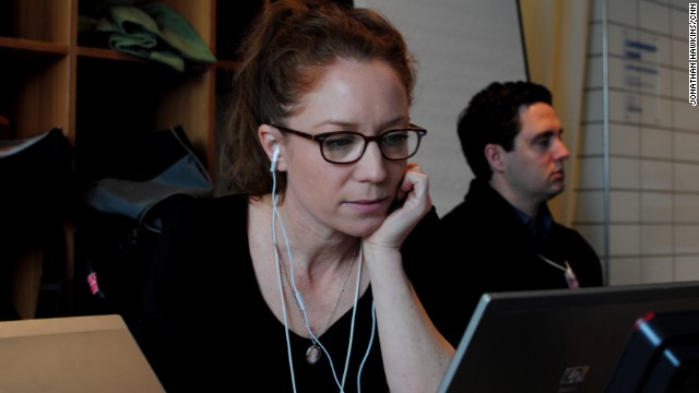 Irene Chapple, CNN digital producer, is working on her story in CNN's makeshift Davos bureau. 